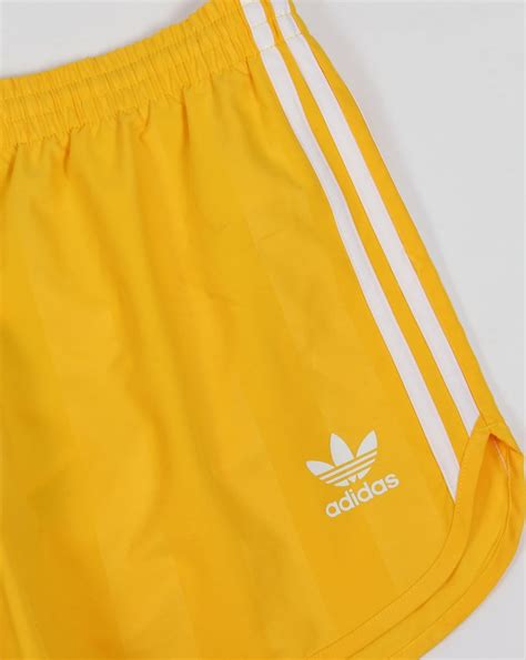 adidas Originals Island Club shorts in yellow.